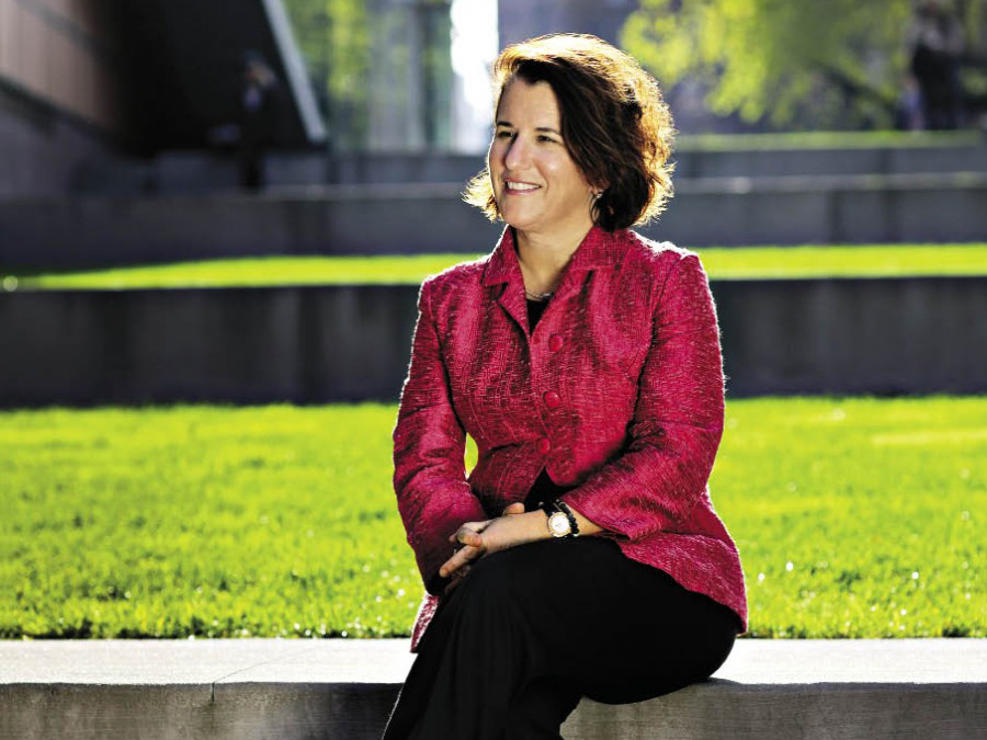 Provost Linda Bell sitting outside Barnard Campus