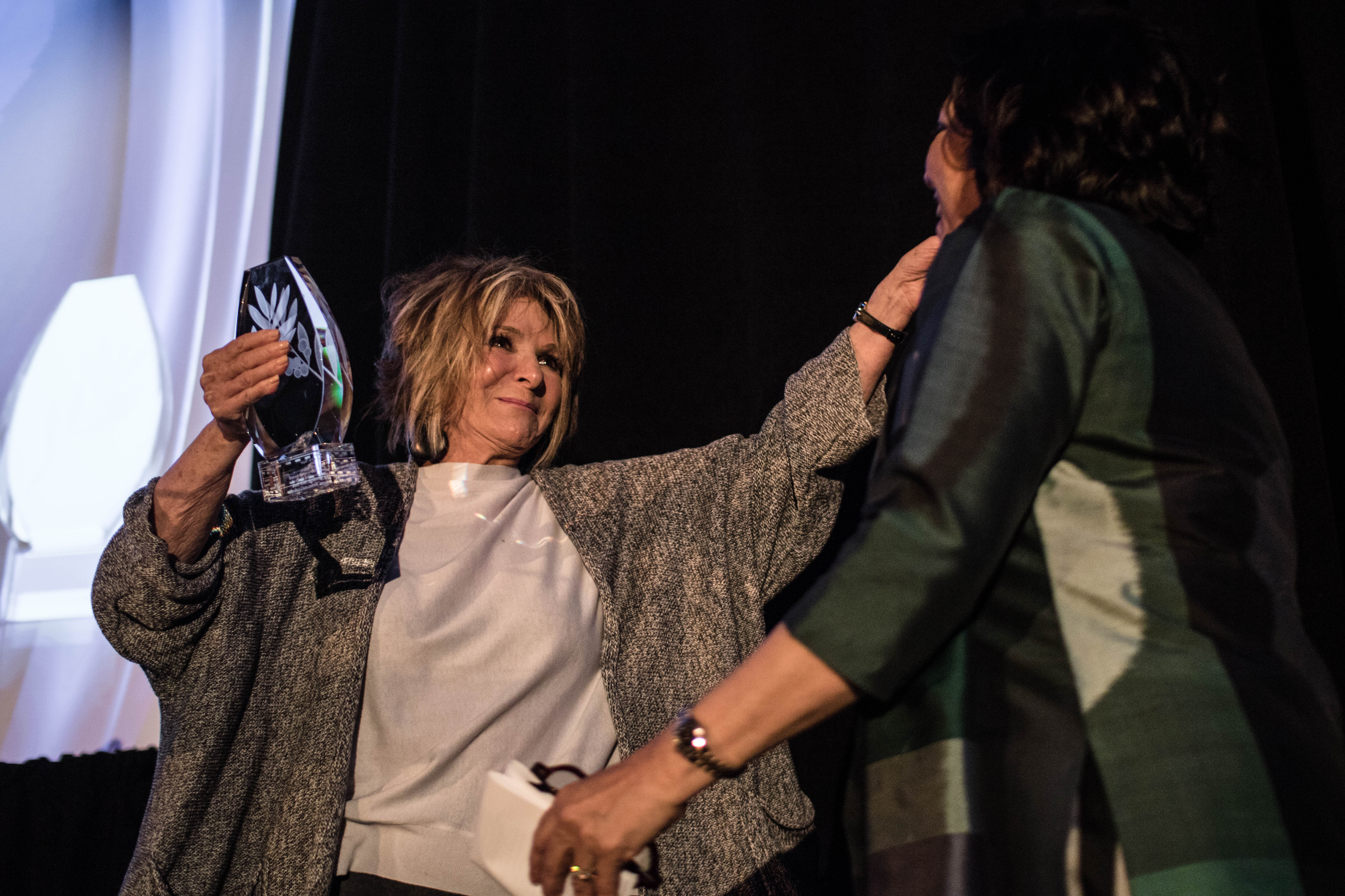 Sheila Nevins receiving an award. 