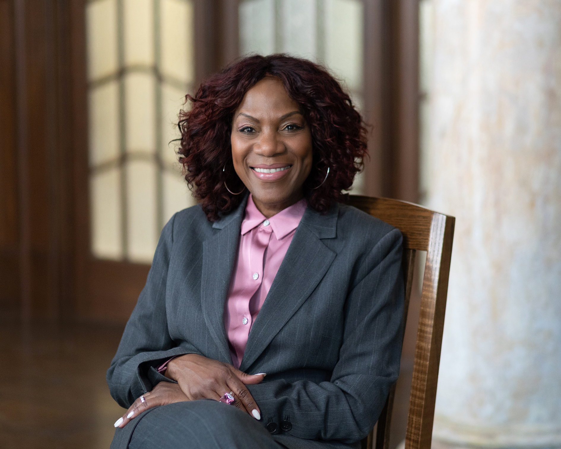 photo of sharon hewitt watkins sitting in a chair