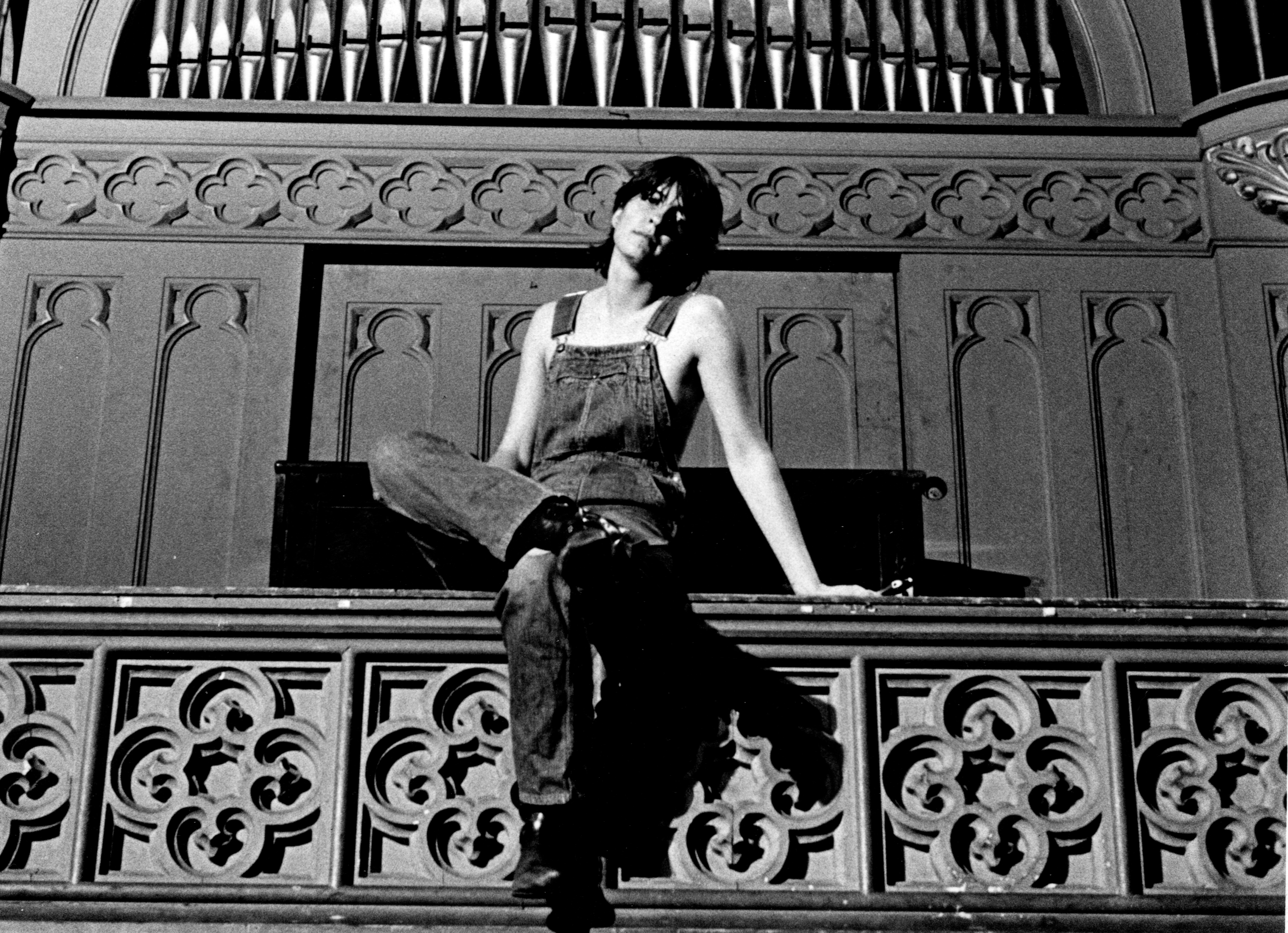 Denny Partridge in front of organ. 