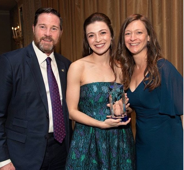 Rinehart with her Rising Star Award alongside Paul Torre and Dawn Saffayeh.