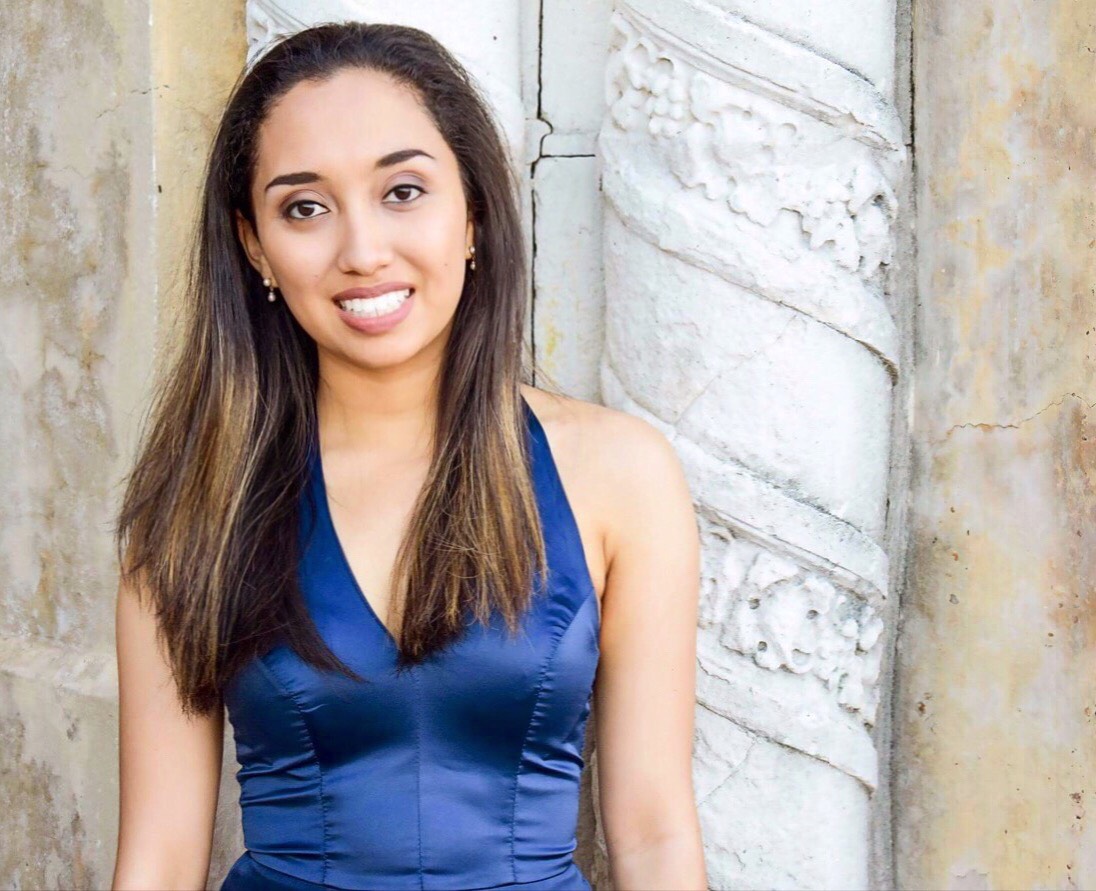 Young woman in blue top.