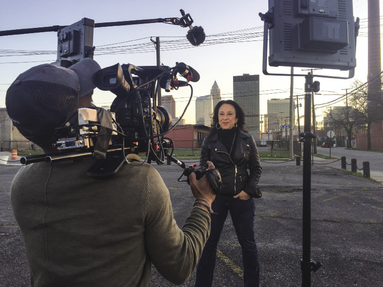 woman speaking in front of video camera