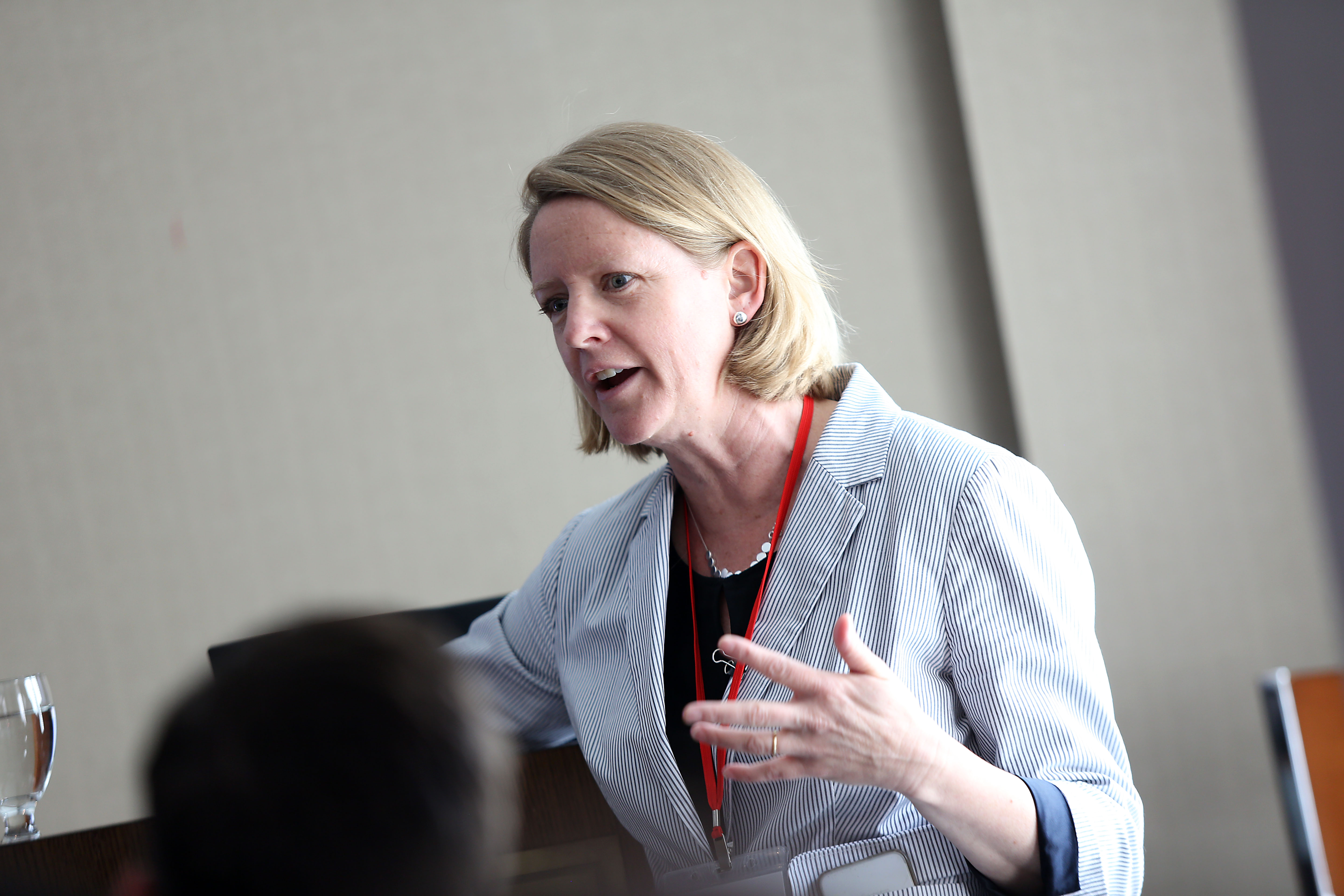Stephanie M. Jones presenting onstage. 