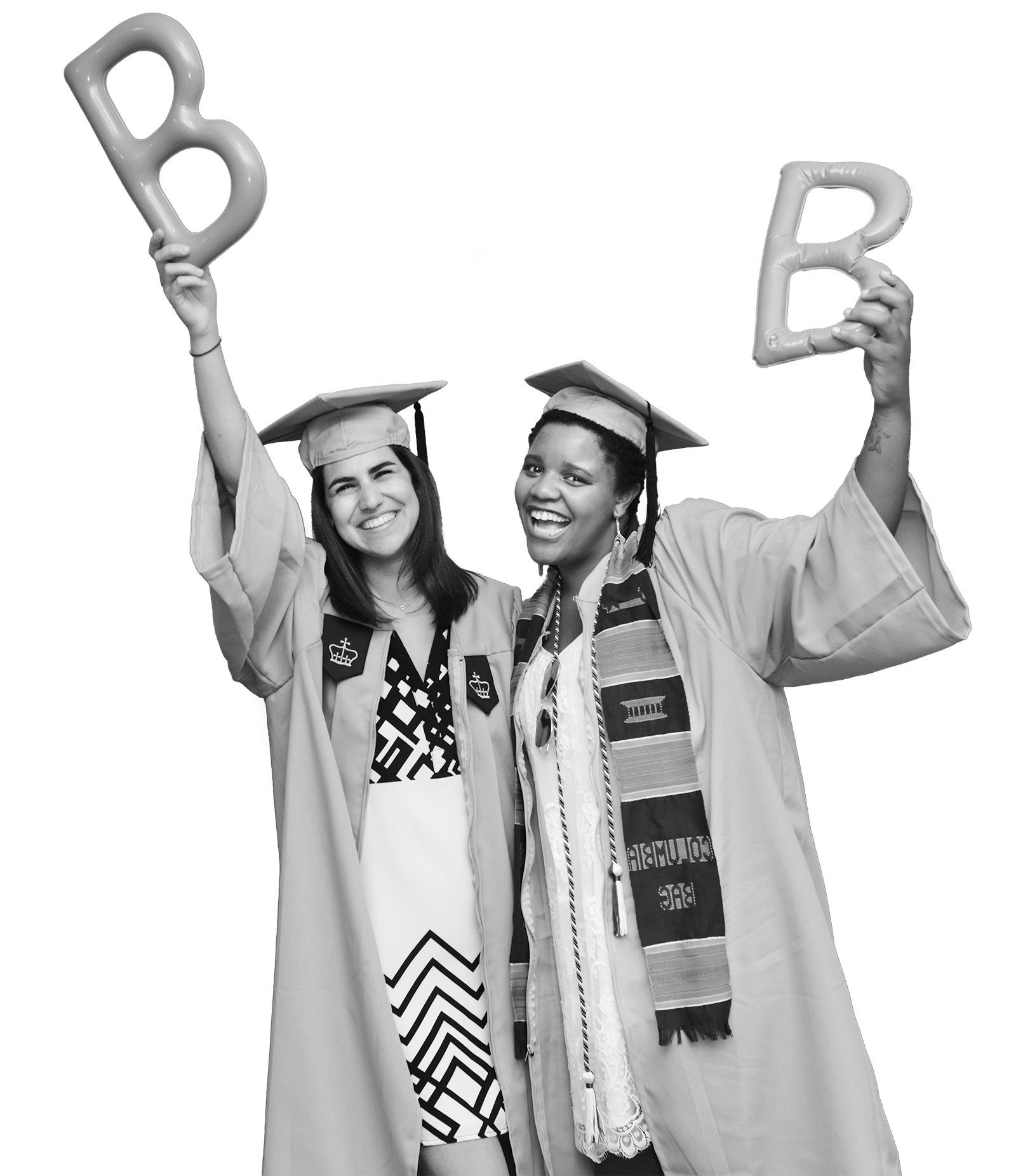 2 graduates in commencement regalia