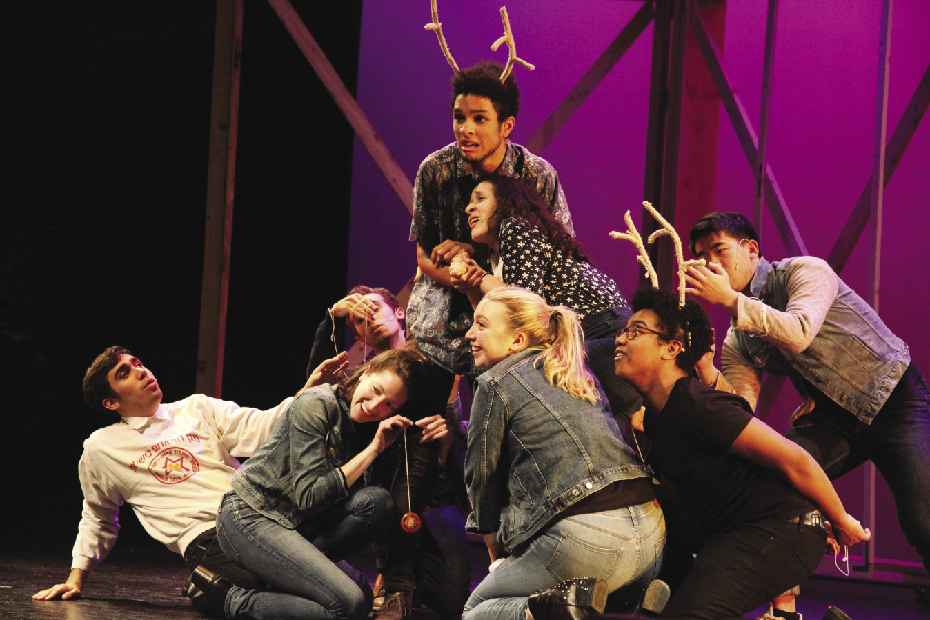 Students formed in a pyramid as part of a dance