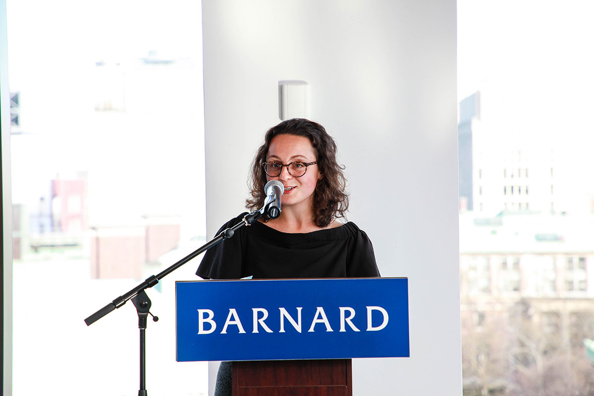Kayla Levy Rennert speaking at a podium at Barnard