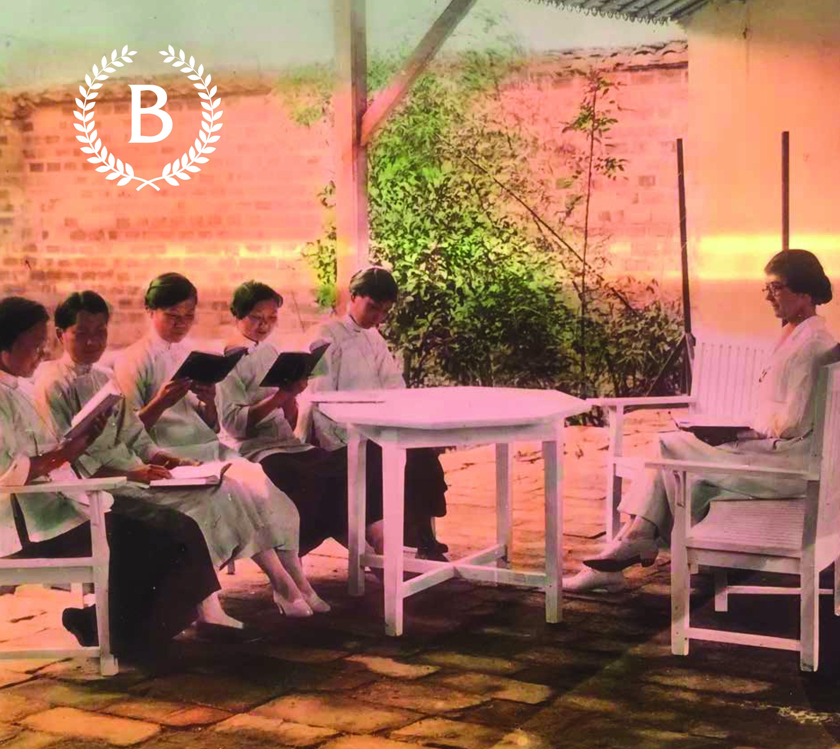 A round table with five Chinese woman studying a text on the left side, and a female instructor on the right side.