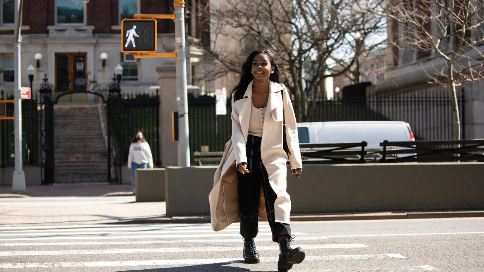 Student Audrey McNeal '24 walks across a New York City street