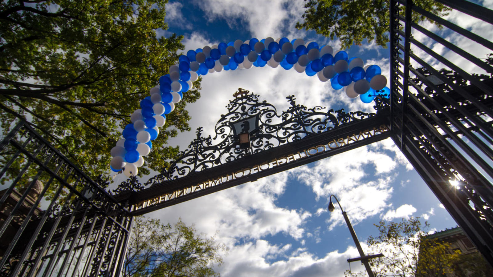 Barnard gate arch covered in white and blue balloons