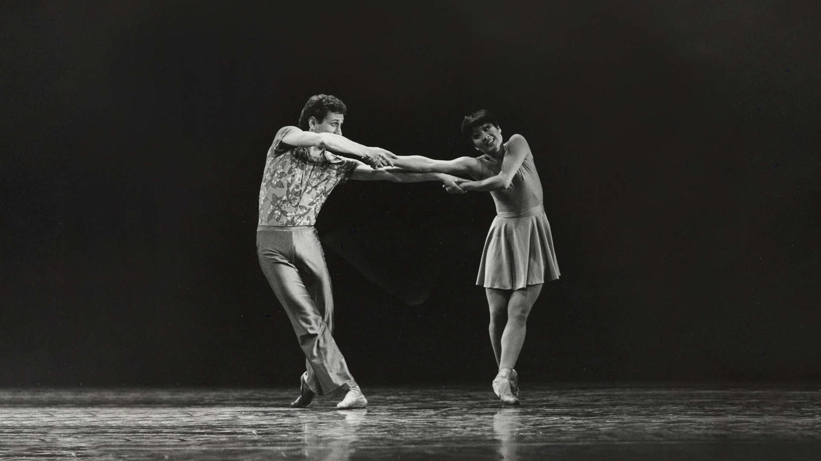Black and white photo featuring a male/female dancers