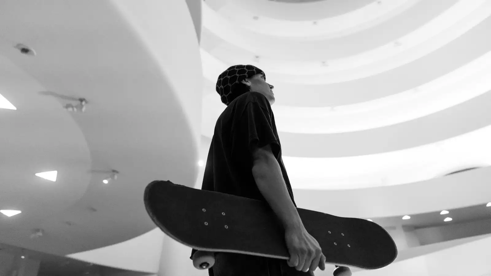 alexis sablone holding a skateboard in the Guggenheim