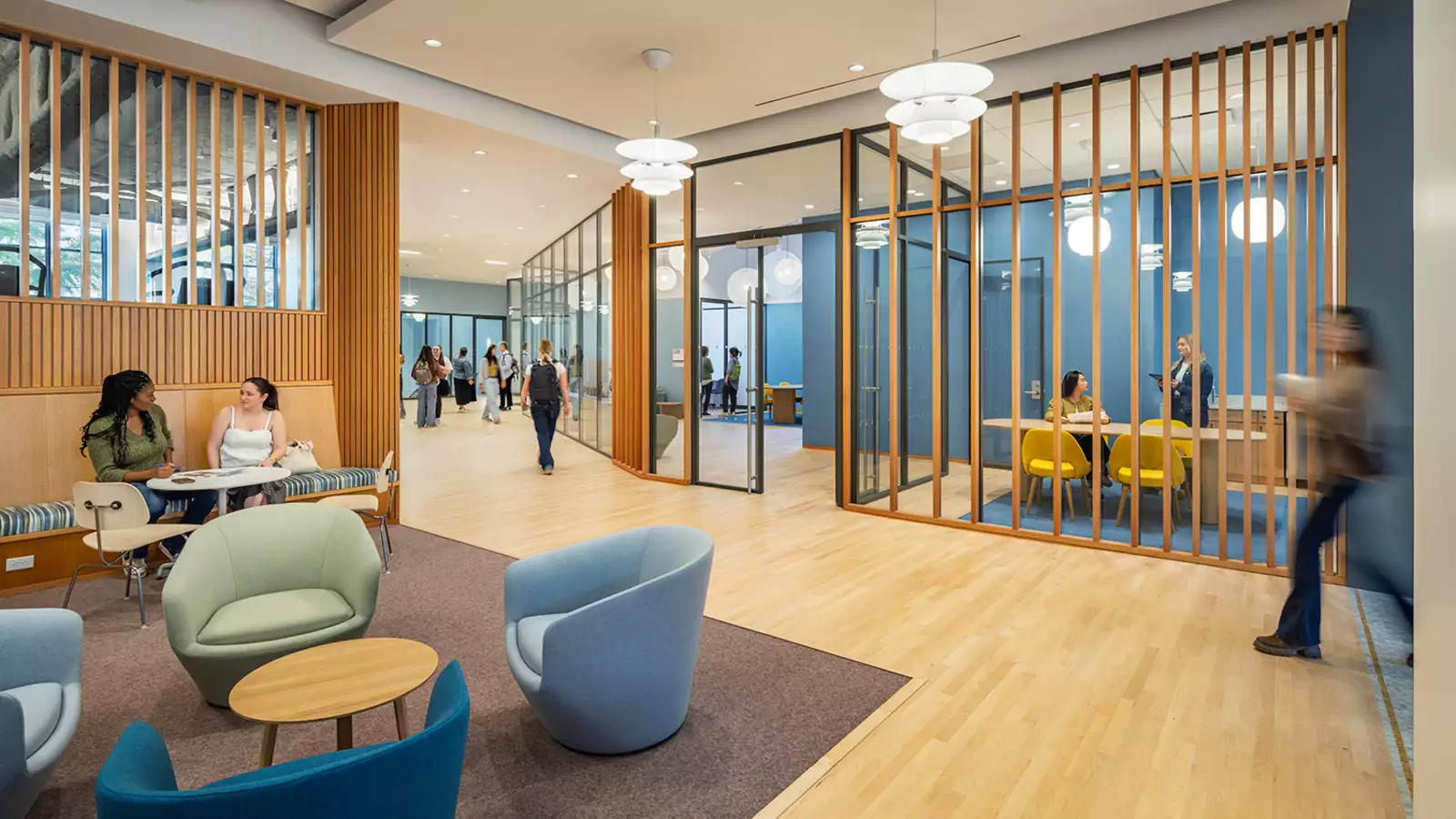 Lobby of the Francine LeFrak Center, an airy room with light-green and blue seating