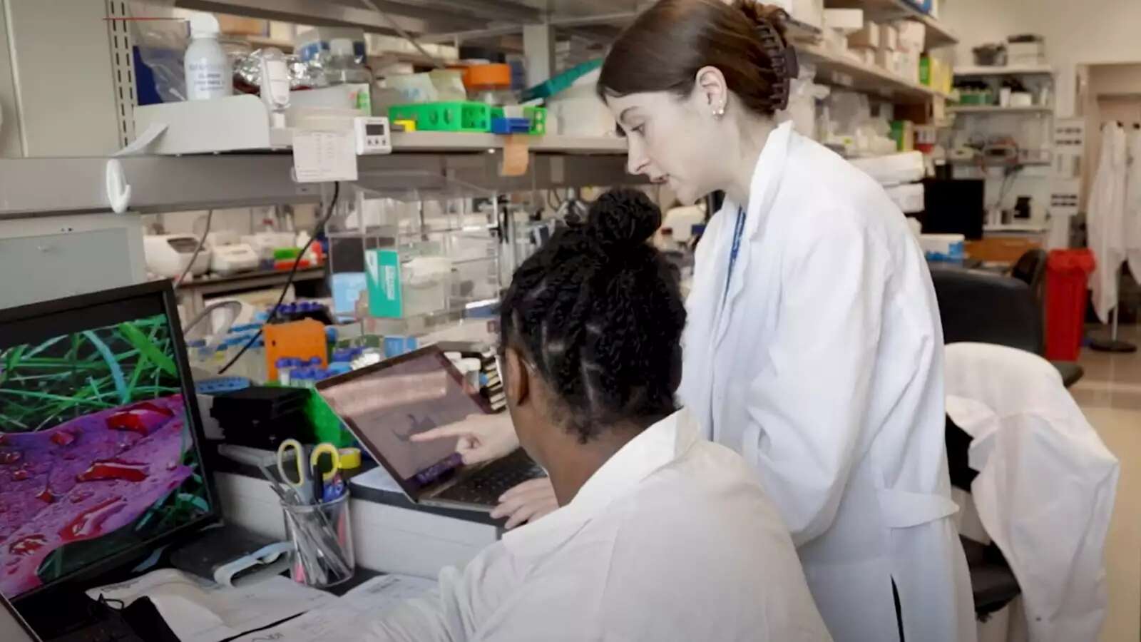 Two students in a science lab