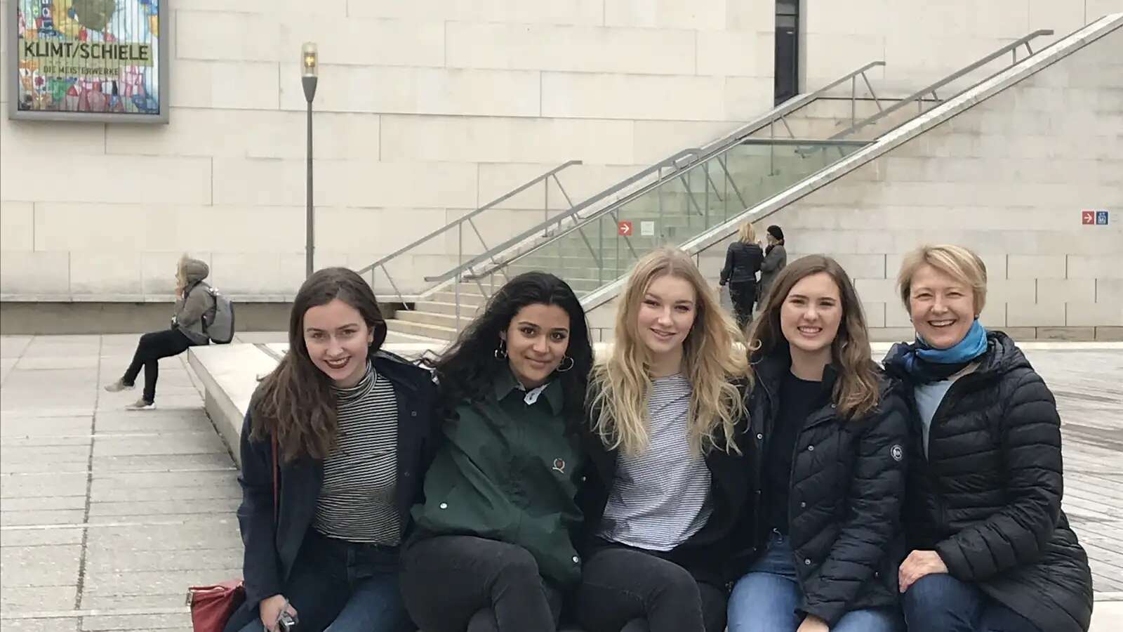 five women sitting outside Leopold Museum