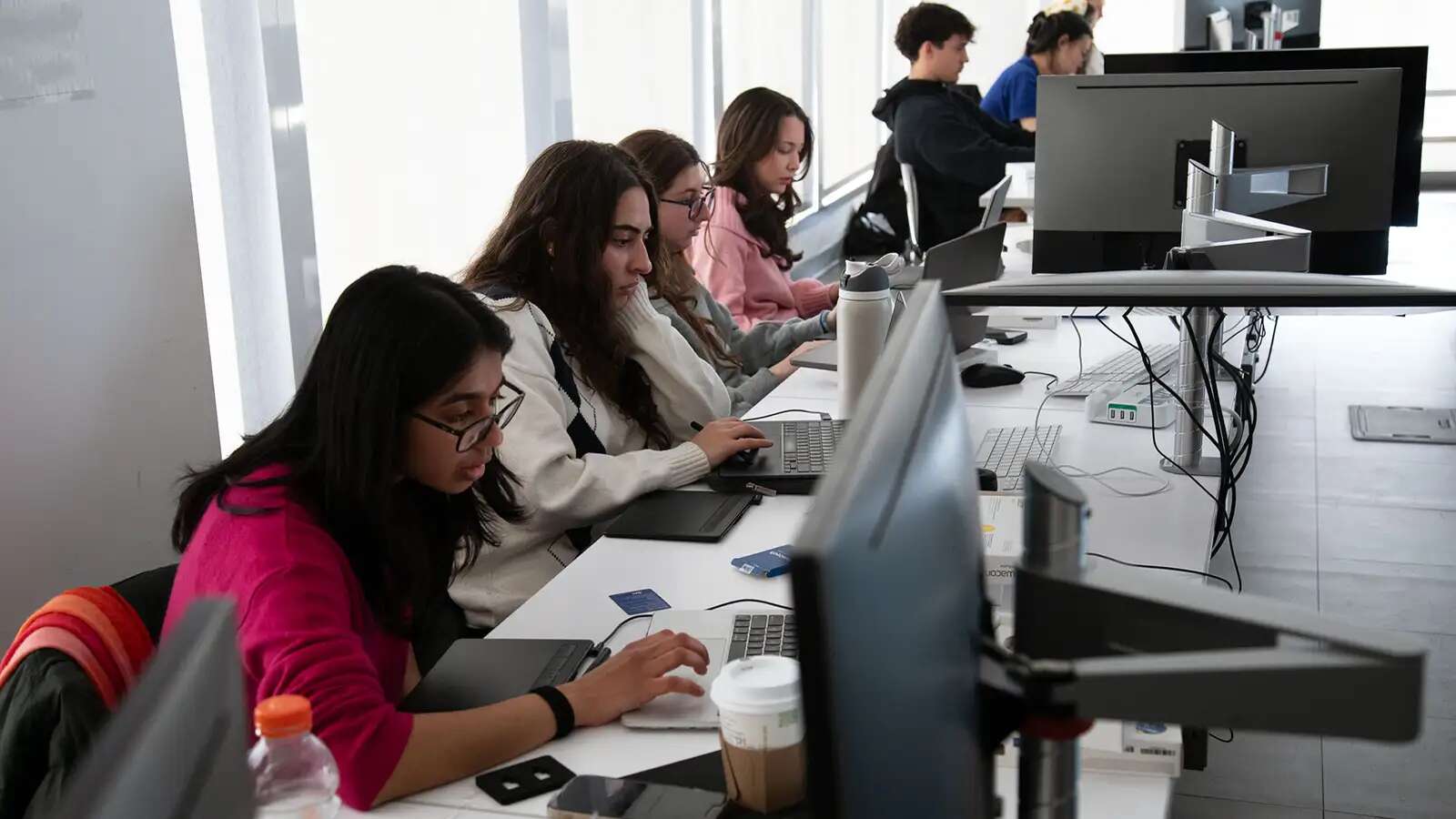 students in a classroom with computers