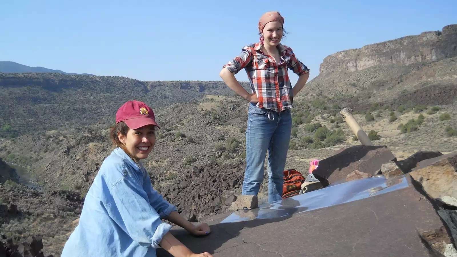 2 young women in a hilly, desert landscape