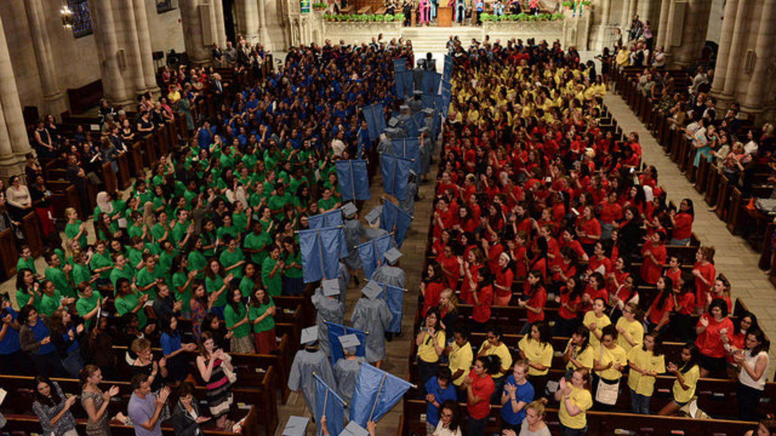 large Barnard audience grouped by the color of their shirts