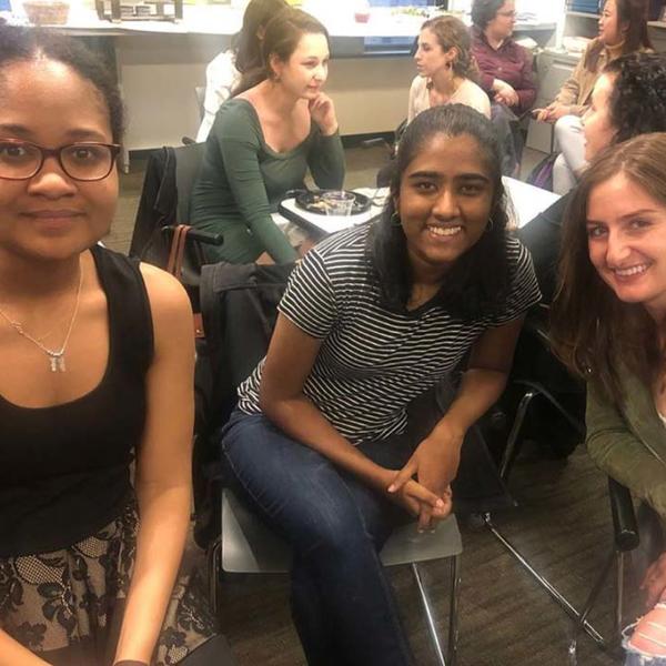 Young women of color at a networking event