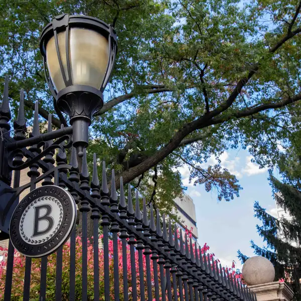 Barnard campus gates with the Barnard "B" sign