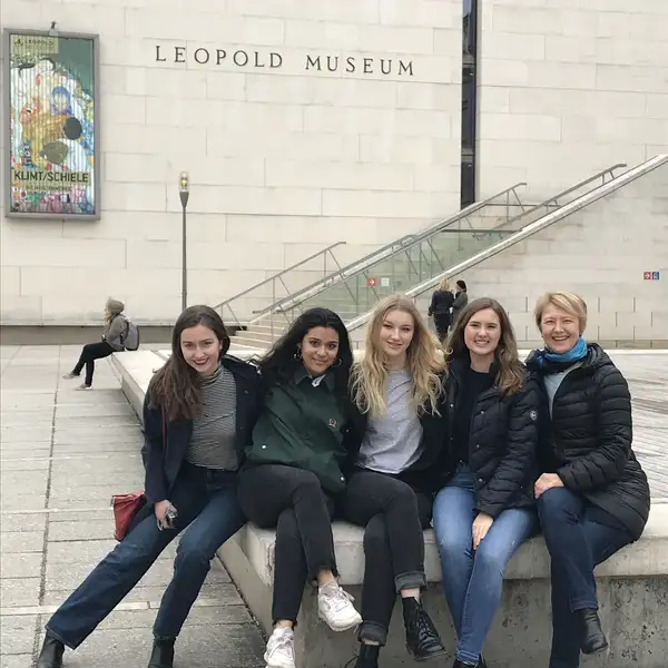 five women sitting outside Leopold Museum