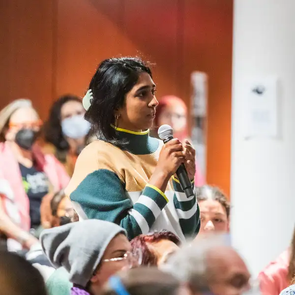 student with microphone