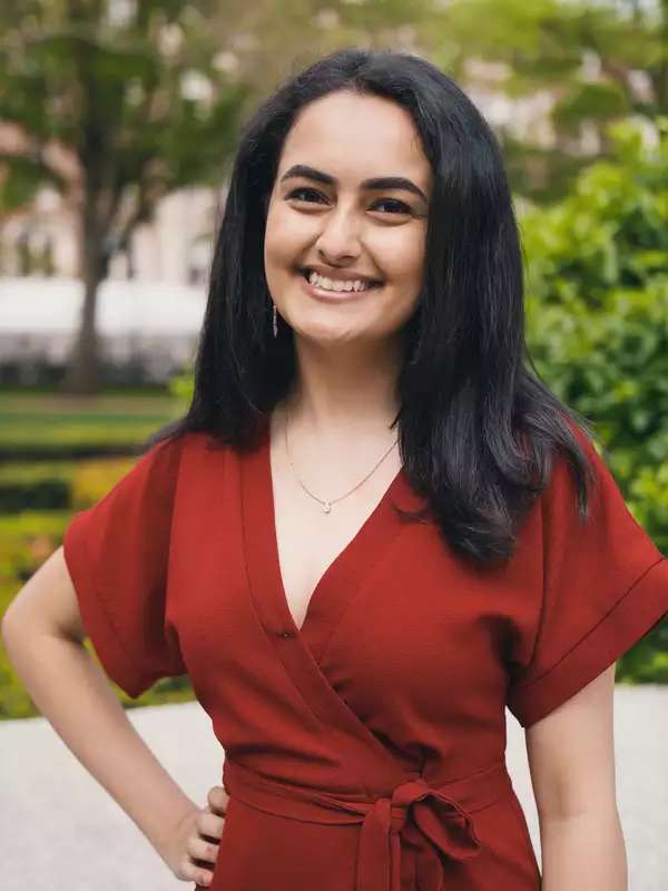 woman in a red dress smiling