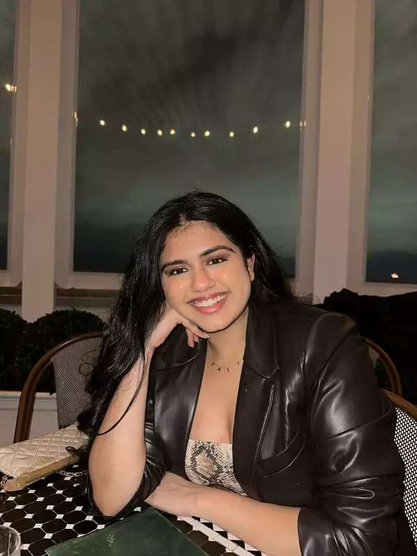 Payal Sreewastav sitting down wearing a brown blazer