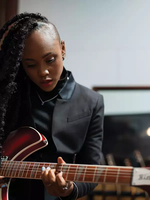 Ebonie Smith plays guitar