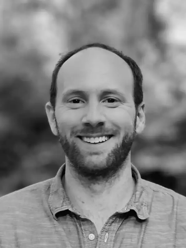 black and white headshot of Jonathan Lambert