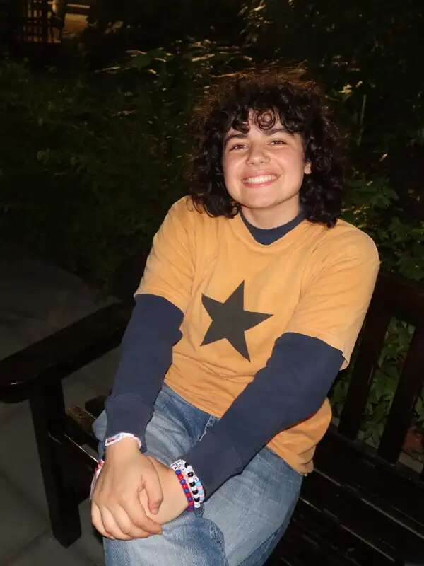 Girl with short hair smiling at camera 