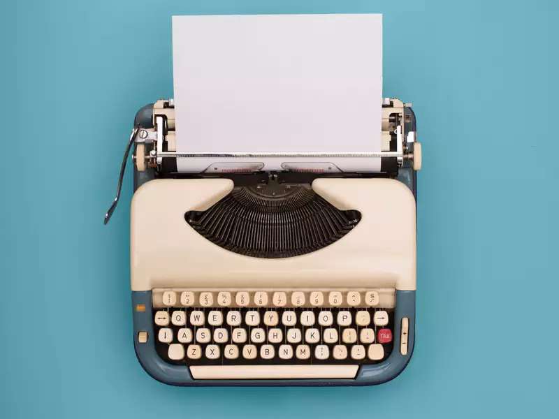 An old school typewriter with a blue background