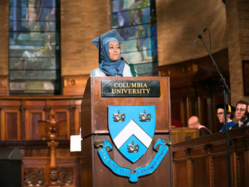 Grad speaking at podium