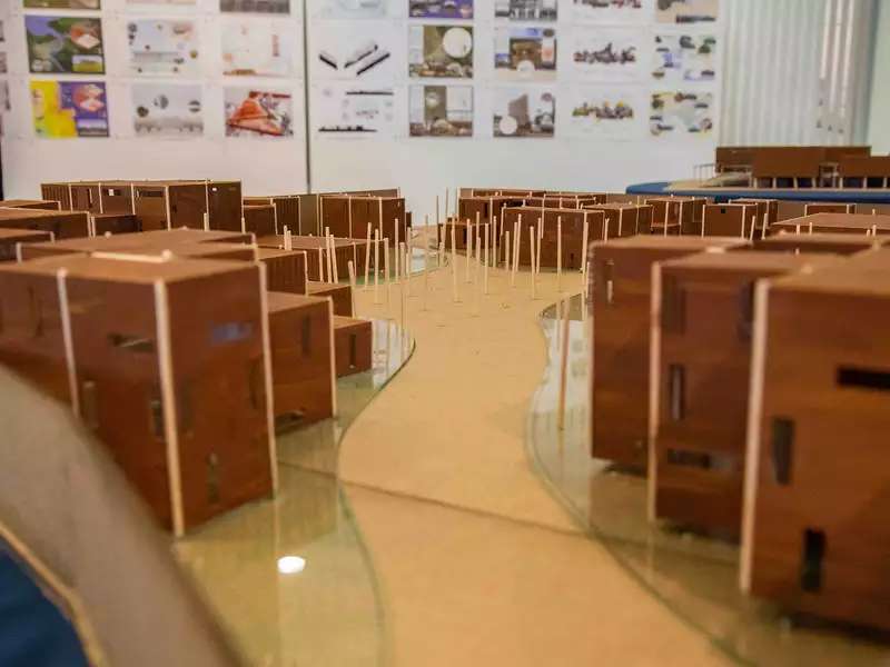 architectural models on a table in a classroom