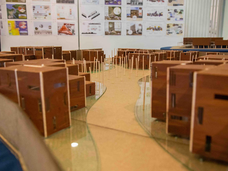 architectural models on a table in a classroom