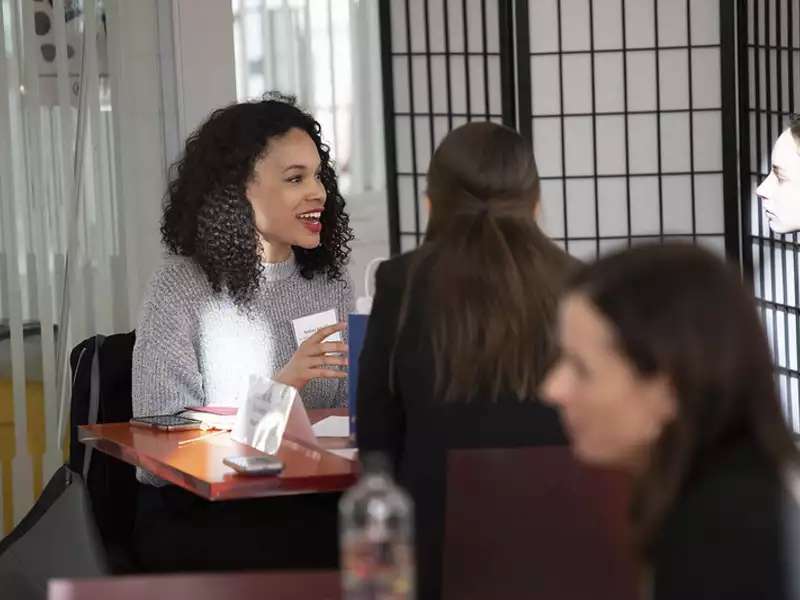 alum giving advice to a Barnard student at a Coffee Chats event