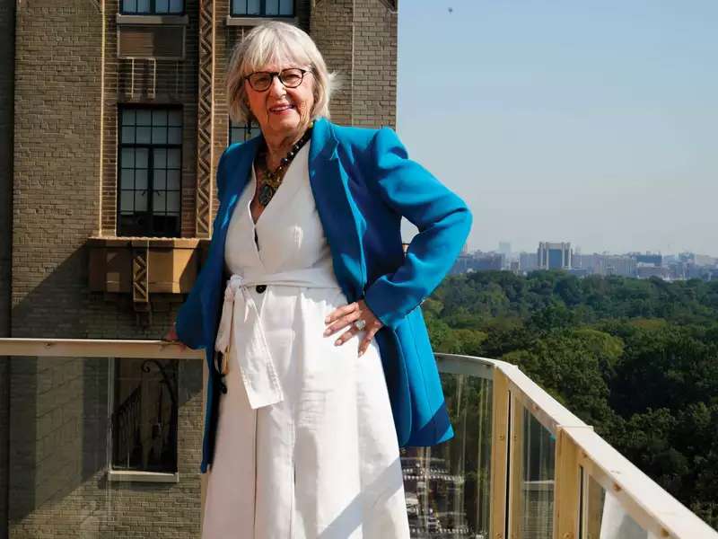 Harriet Newman Cohen standing on a balcony