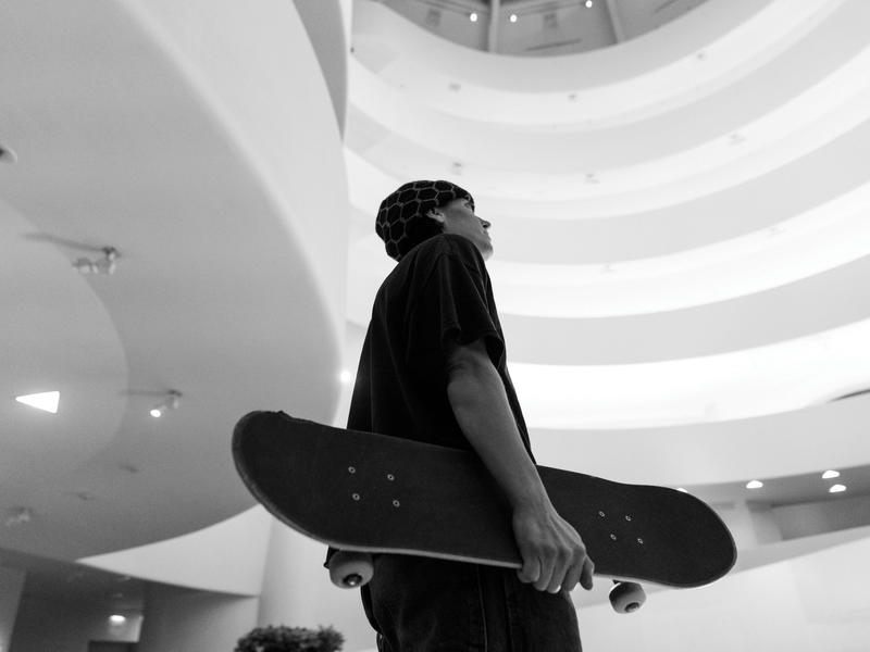 alexis sablone holding a skateboard in the Guggenheim