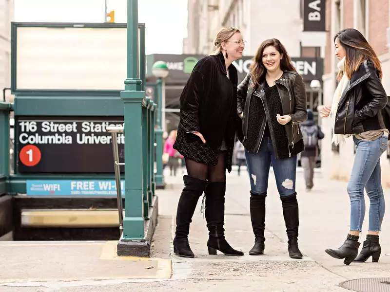 3 women outside the 116th st subway entrance
