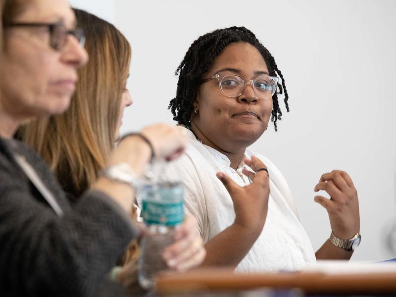 Black woman speaking on an employer panel