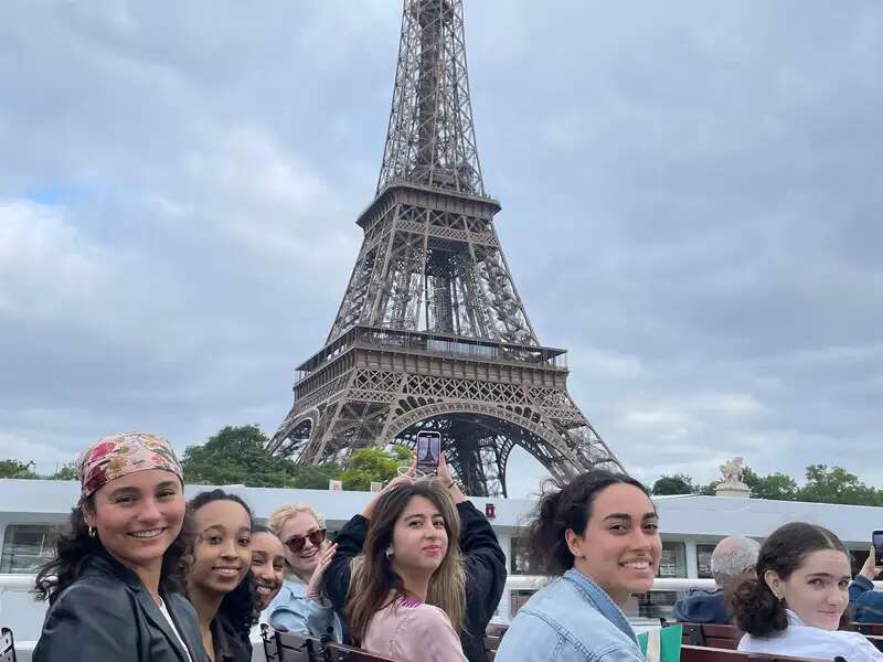 Students riding by the Eiffel Tower on ferry