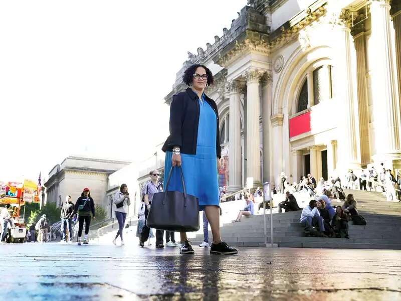 Miller walking in front of the Met museum in NYC