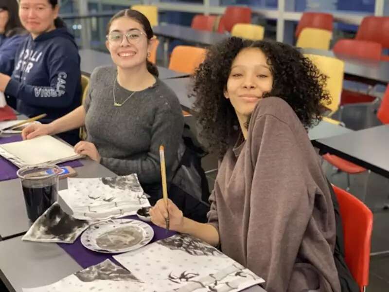 Two students at a desk