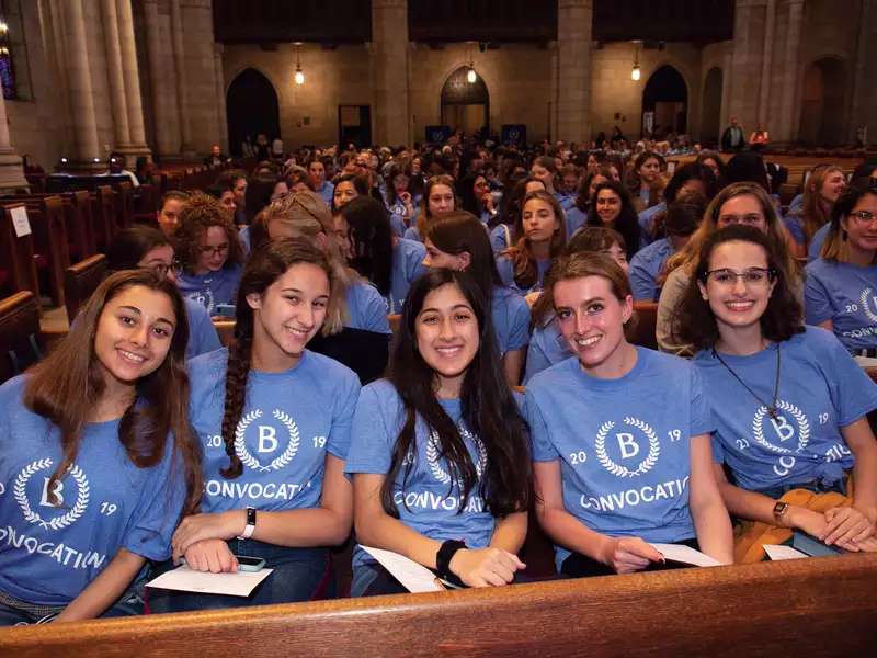 First-year students assembled in Riverside Church wearing matching convocation t-shirts