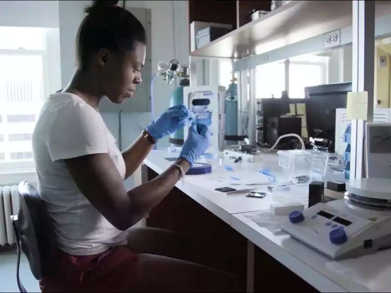 Black woman student working in a science lab