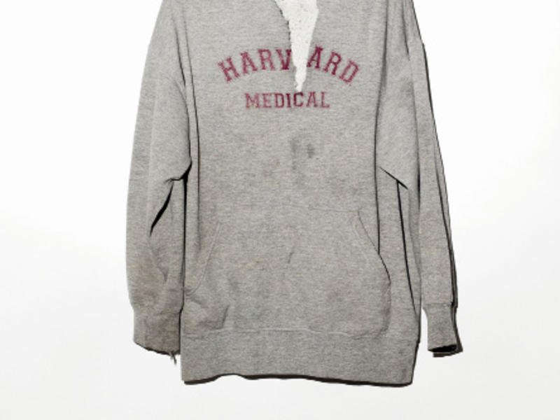 a worn, gray Harvard sweatshirt
